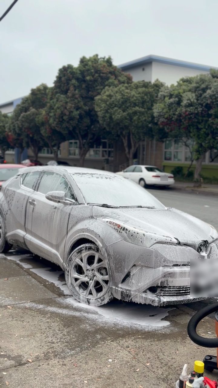 Silver Toyota C-HR covered in foam during a NOVA hand wash